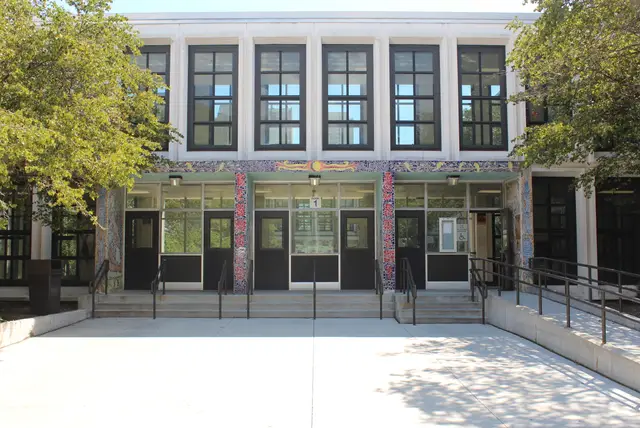 Main entrance facade of Kenwood Academy High School in Hyde Park