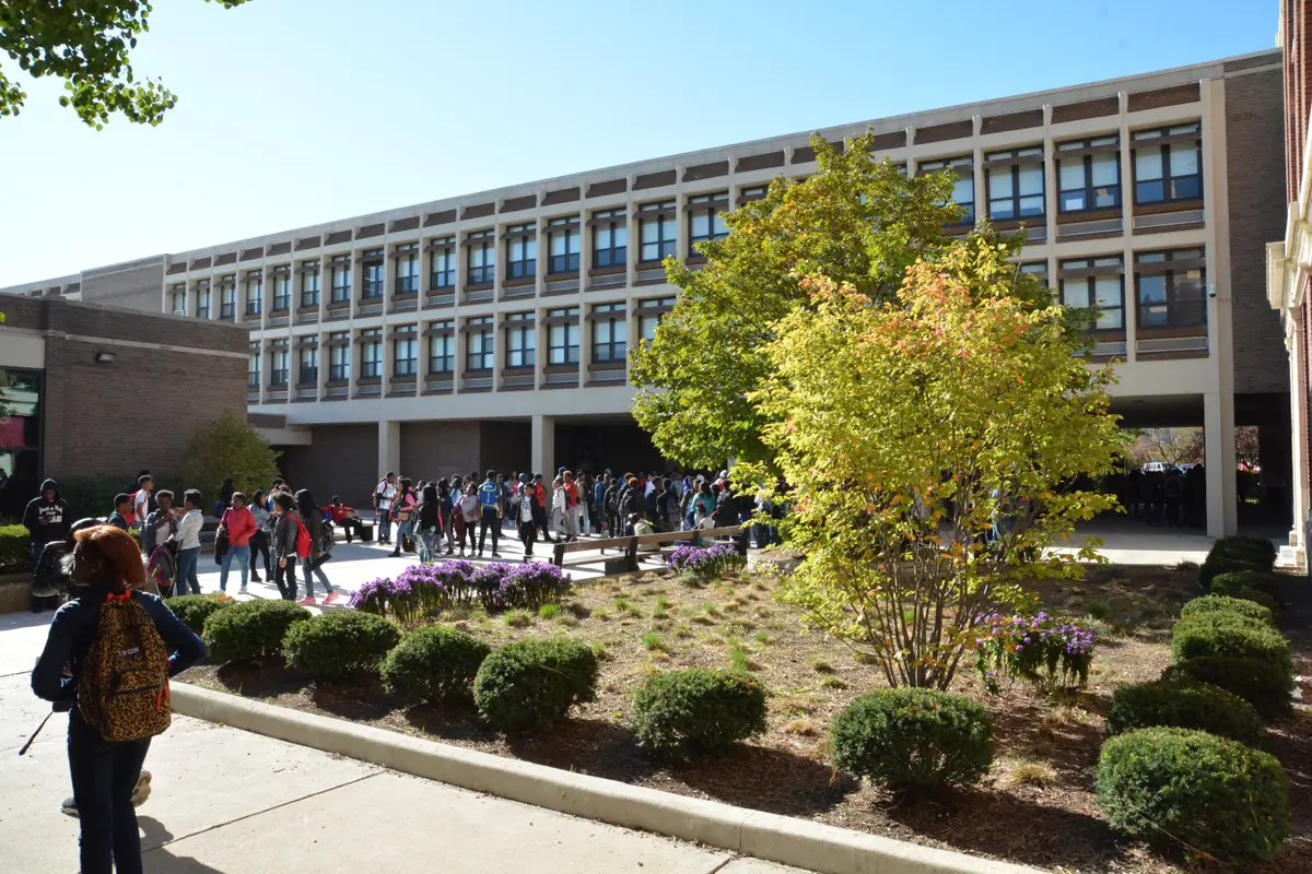 Exterior of Morgan Park High School with students outside